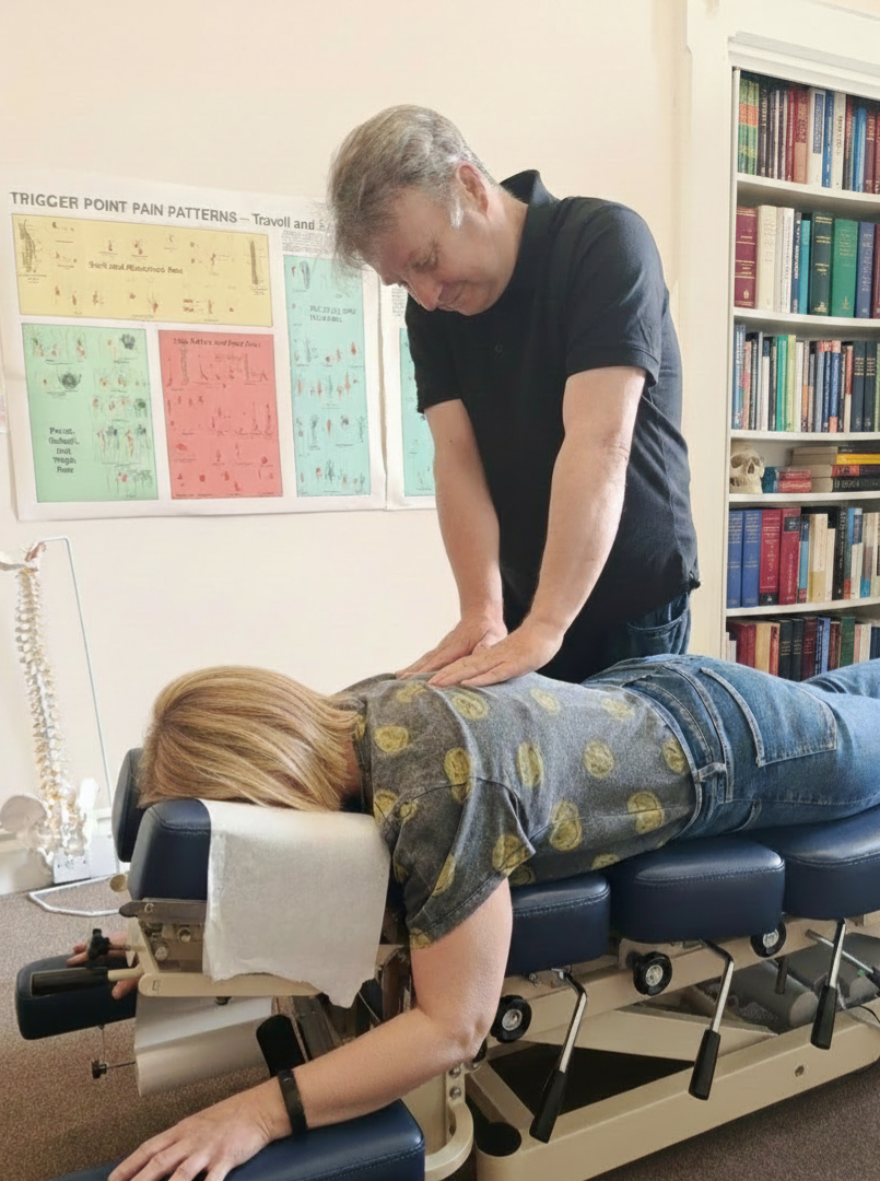 Chiropractor adjusting a patient's back